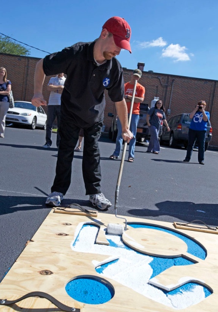 Events often look like this one, where self-advocates with disabilities are able to speak for themselves to able-bodied counterparts, advocating for the features of an inclusive world that are important to them. The physical act of painting over faded parking lot stencils makes the project an event-based one, not just a graphic.