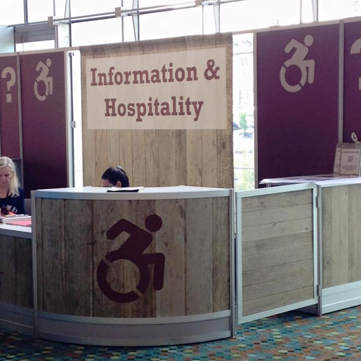 Nearly every week, someone submits a photo from somewhere in the world that the icon appears: like at this registration/information booth at a conference, painted with giant accessible icons. Photo by Christofu Yang.